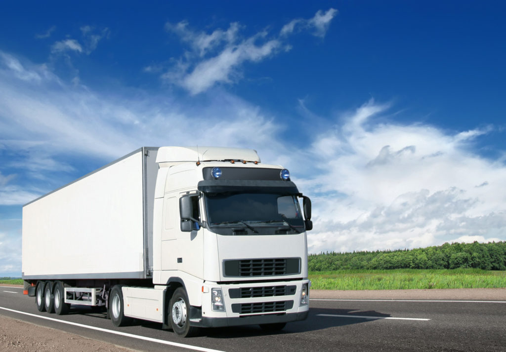 white truck on summrt country highway