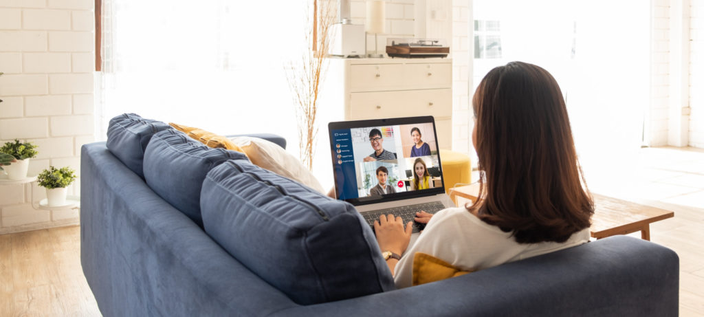 Young Asian businesswoman work at home and virtual video conference meeting with colleagues business people, online working, video call due to social distancing at home office