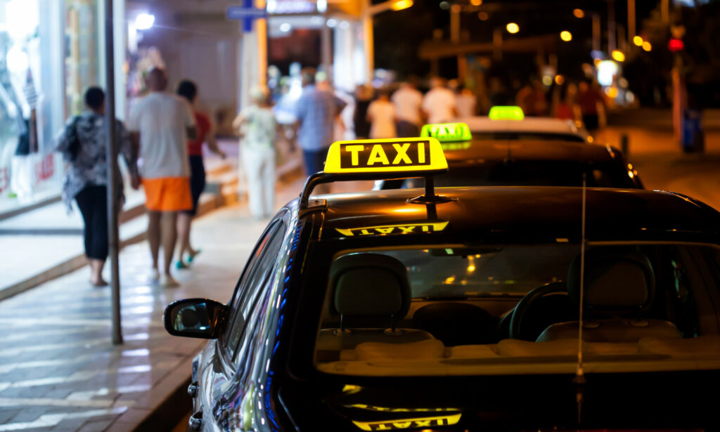 Taxi sign on a car at night