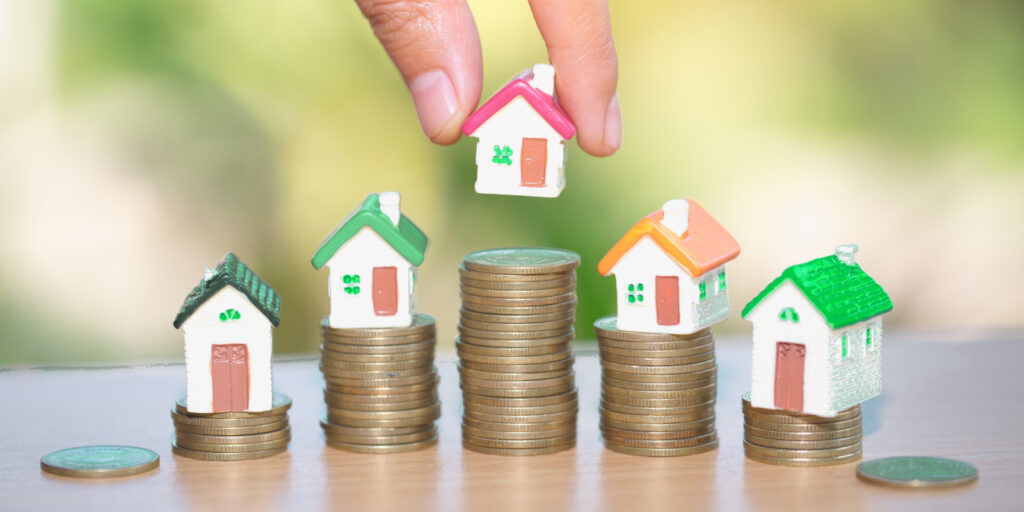 Mini house on stack of coins, Real estate investment, Save money with stack coin, Business growth investment and financial, Mortgage concept.